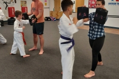 Parents and their KFMA Kids enjoy training together on "Bring Your Parent to Class Day!"