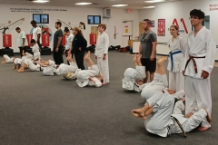 Students, parents and kids working on a lower ab drill, as these are the same muscles used in chambering the legs for kicking! 