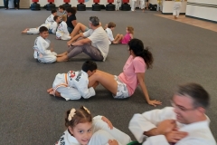 Parents working on sit-ups with their Kids during Tiger class!