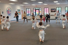 KFMA Tigers enjoying a cardio drill while their parents hold the targets!