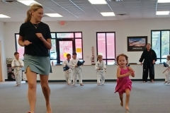 Mother and daughter enjoying running together during a cardio drill!