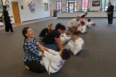 Our KFMA Tigers are still learning to do sit-ups properly, which are a lot more fun when working with their parents!