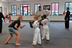 Parents work on punching drills while their kids hold the targets! 