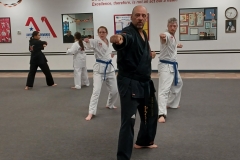 High rank color belt Adults working on their traditional Songahm forms in the evening Family class. Our Black Belts assist the lower ranks with their material in almost every class! 