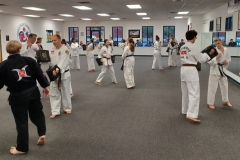 Adults and teens training together during a KFMA Family class! 