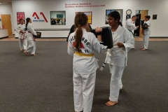 Teen girls working together during a KFMA Family class!