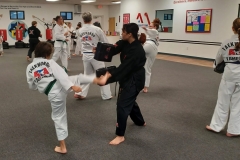 In KFMA Family classes, Black Belts frequently work with lower ranks to assist in their training!