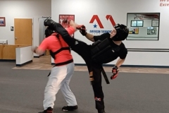 Adult Black Belts working on sparring drills.