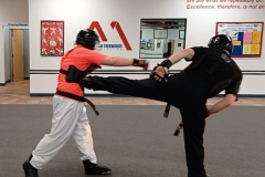 The front leg (#1) side kick is part of the basic defense in sparring, as demonstrated by two KFMA Adult Black Belts. 