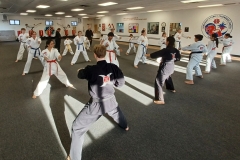 During a KFMA Martial Arts Family Class, adults, teens and kids begin their warm-up with a punching drill. During a KFMA Martial Arts Family Class, adults, teens and kids begin their warm-up with a punching drill.