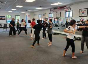 Women practicing punching at KFMA Women's Self-defense seminar