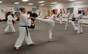 Adults training together during a KFMA Family Martial Arts Class!