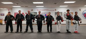 KFMA Black Belt Teens and Adults lined up after sparring during a KFMA High-Rank Black Belt testing.