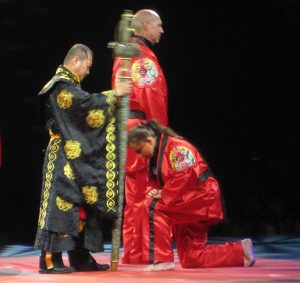 Chief Master Laura Kowkabany being dubbed as a Chief Master Instructor by Grand Master In Ho Lee in 2013.