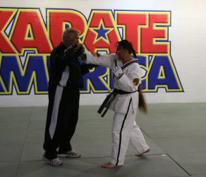 Chief Master Laura Kowkabany training for her testing with her instructor Grand Master Bill Clark. She has trained under GM Clark since 1973!